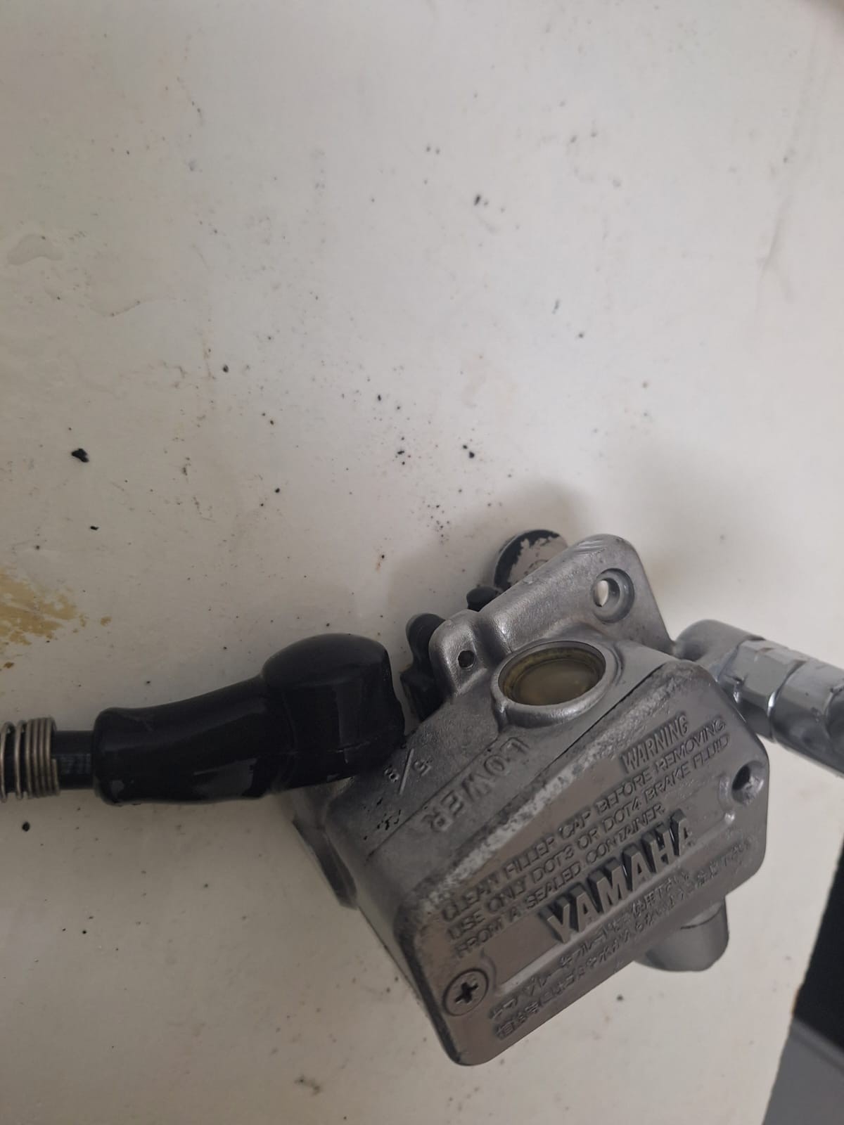 Vapour blasting cleaning aluminium parts in restoration workshop